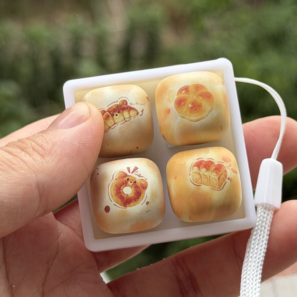 Close-up of the bread collection 4-key keycap clicker