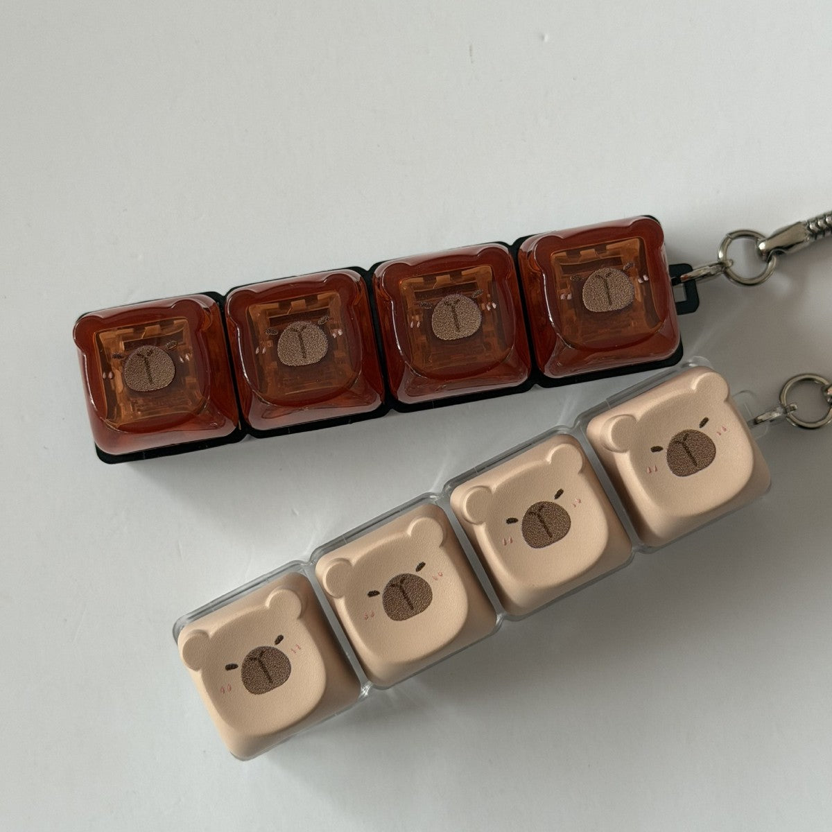 Capybara 4-key keycap clicker keychains in brown and cream