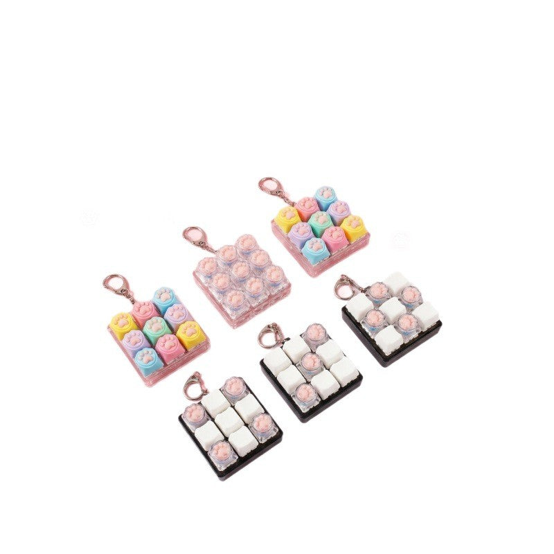 Cat paw keycap clicker keychains in assorted colours and layouts