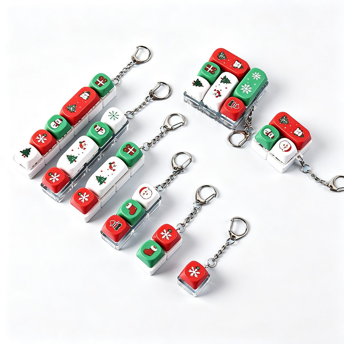 Christmas keycap clicker keychains on a white background