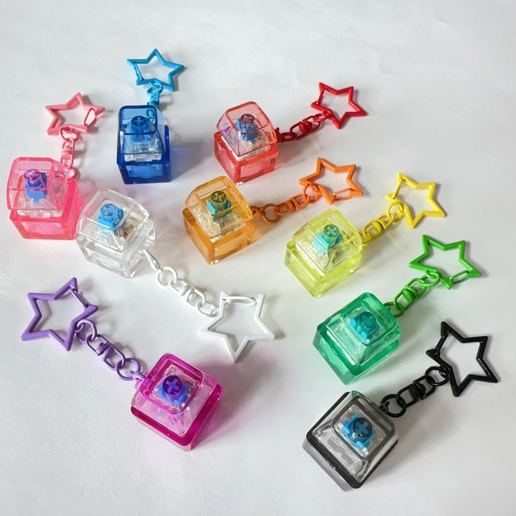 Translucent PC keycap clicker keychains in assorted colours with star chains
