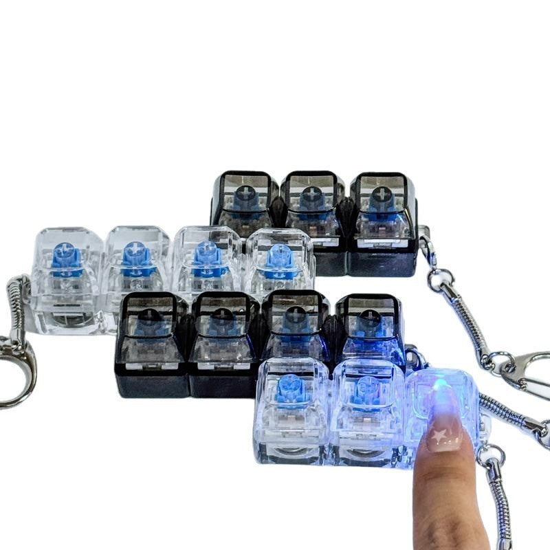Translucent 3-key keycap clicker keychains in clear, black and blue