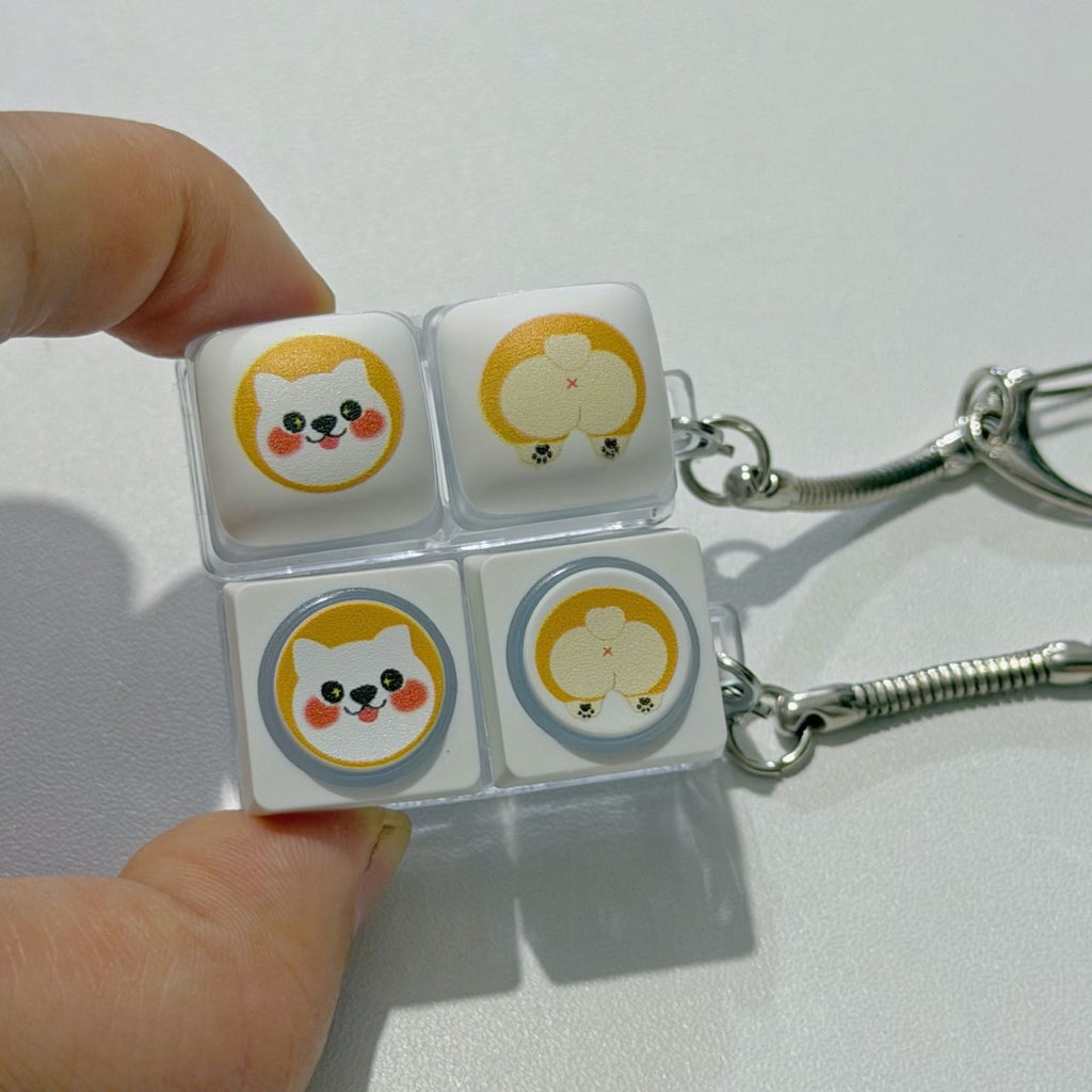 Hands holding corgi face and corgi butt 2-key keycap clicker keychains
