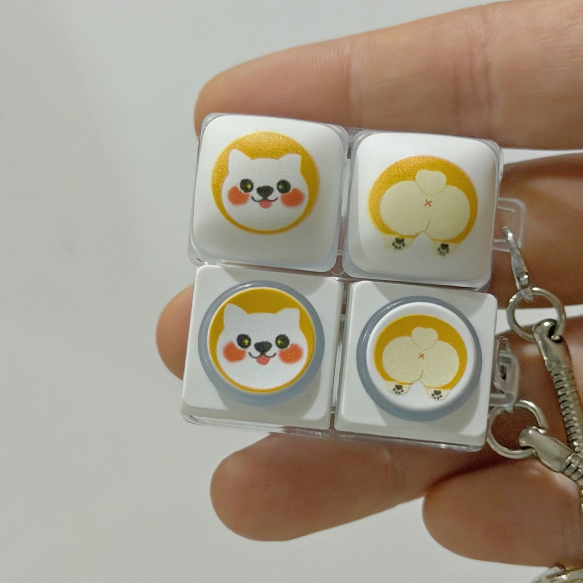 Two corgi 2-key keycap clicker keychains