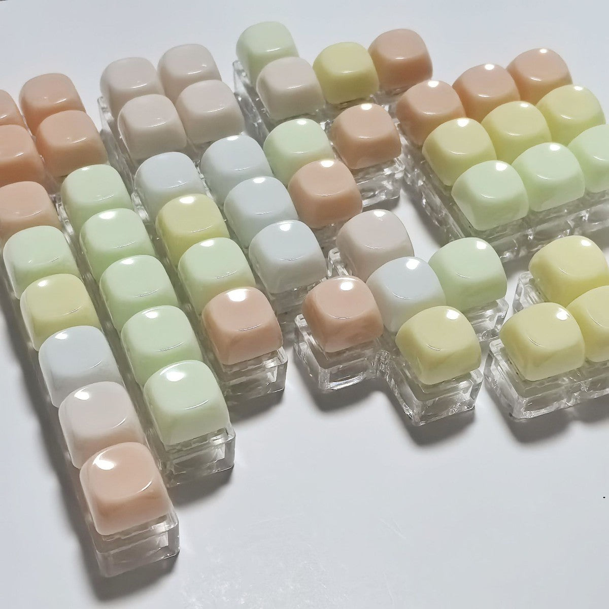 Gummy keycap clicker keychains with many keys in pastel colours