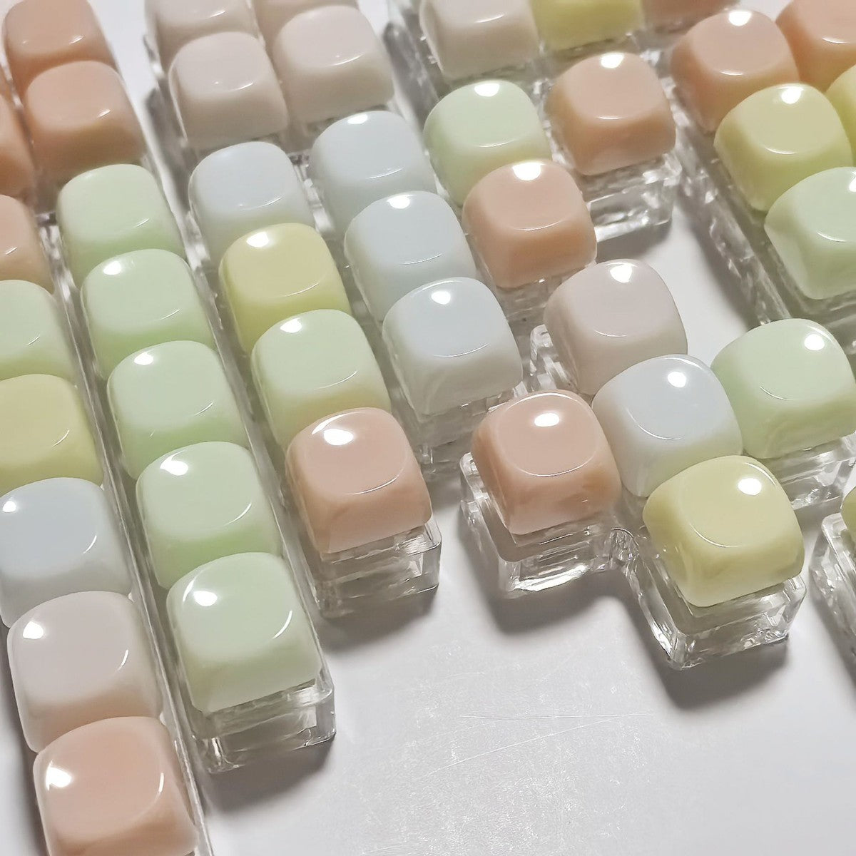 Close-up of rounded pastel gummy keycaps on clear bases