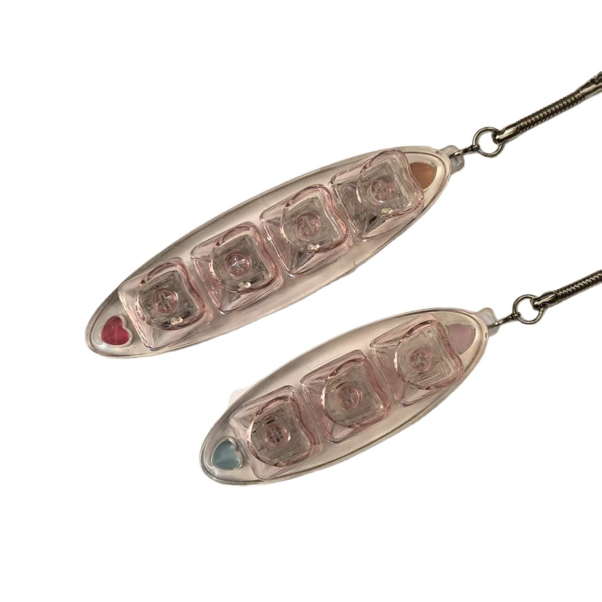Clear leaf-shaped 3-key keycap clicker keychains on a white background