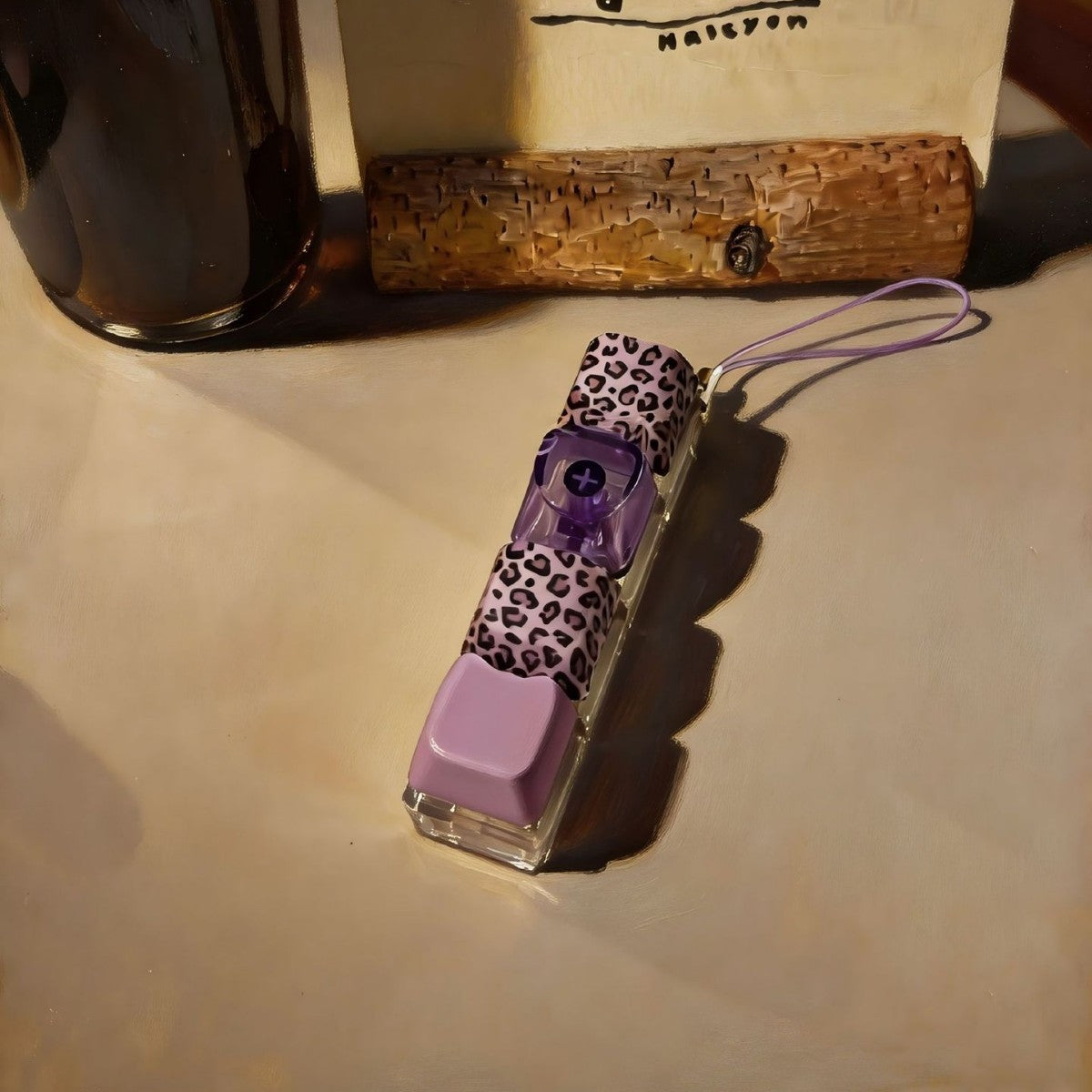 Leopard-print keycap clicker keychains next to a wooden block