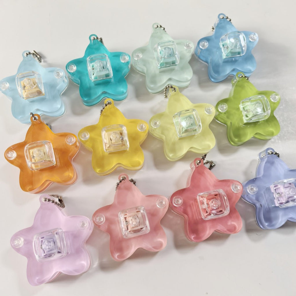Translucent star keycap clicker keychains in assorted colours