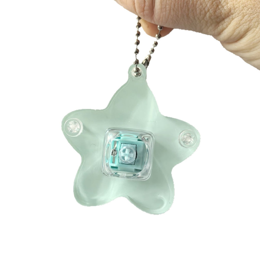 Cyan translucent star keycap clicker keychain on a ball-chain