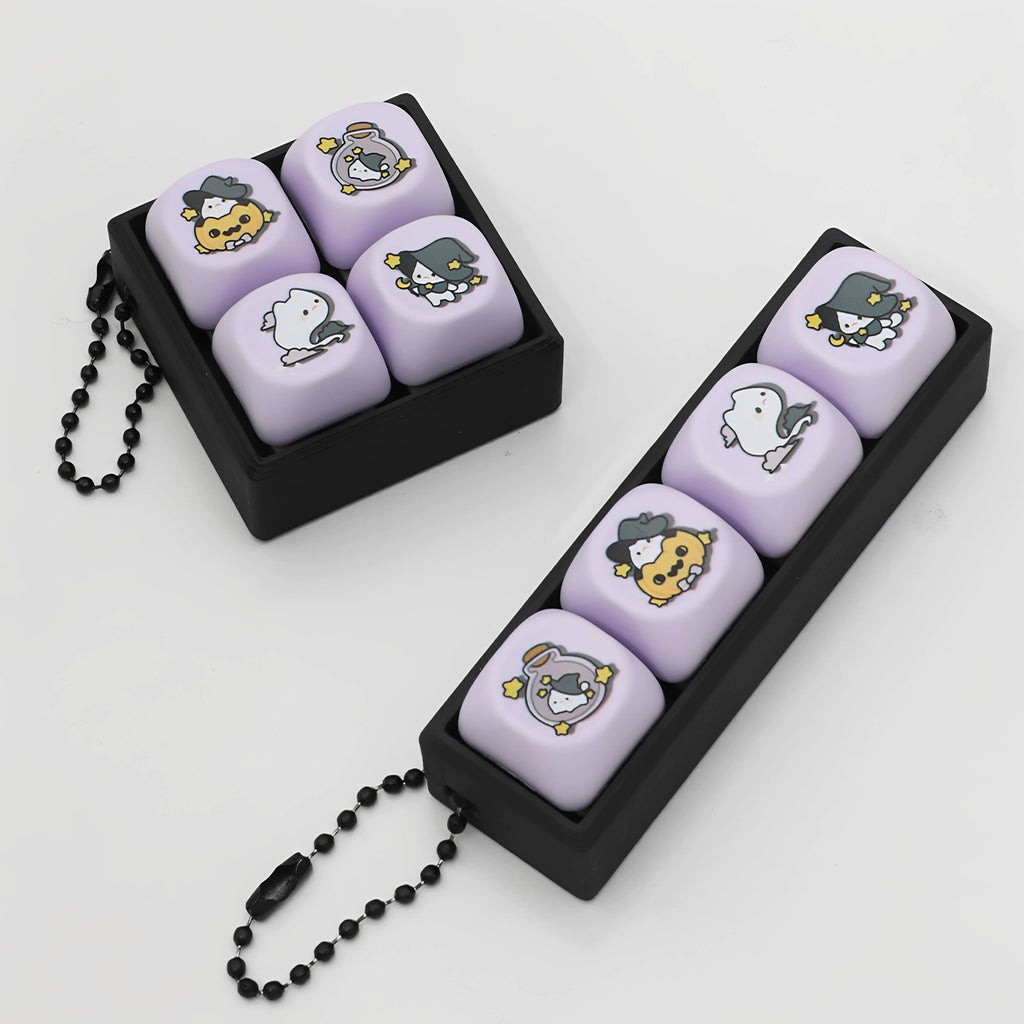 Lavender magic cat keycap clicker keychains in black PLA cases on a white background