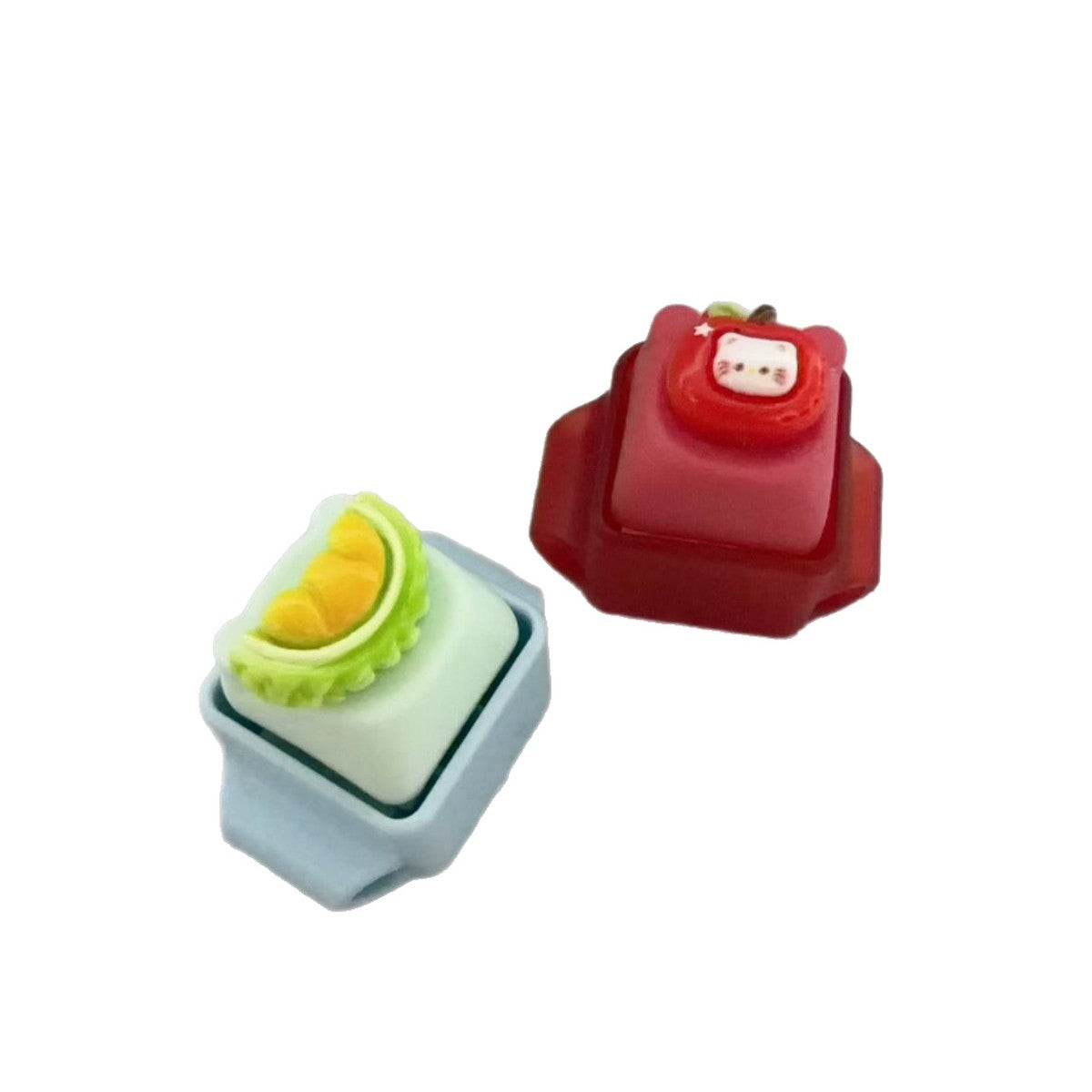 Two loose modular click keys in blue and red
