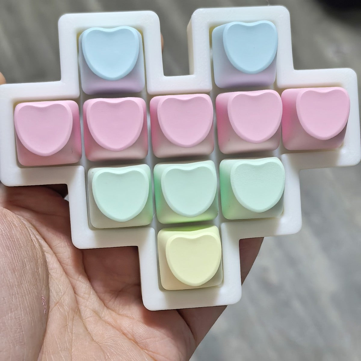 Pastel heart 11-key cross-shaped keycap clicker in pink, blue, mint and yellow