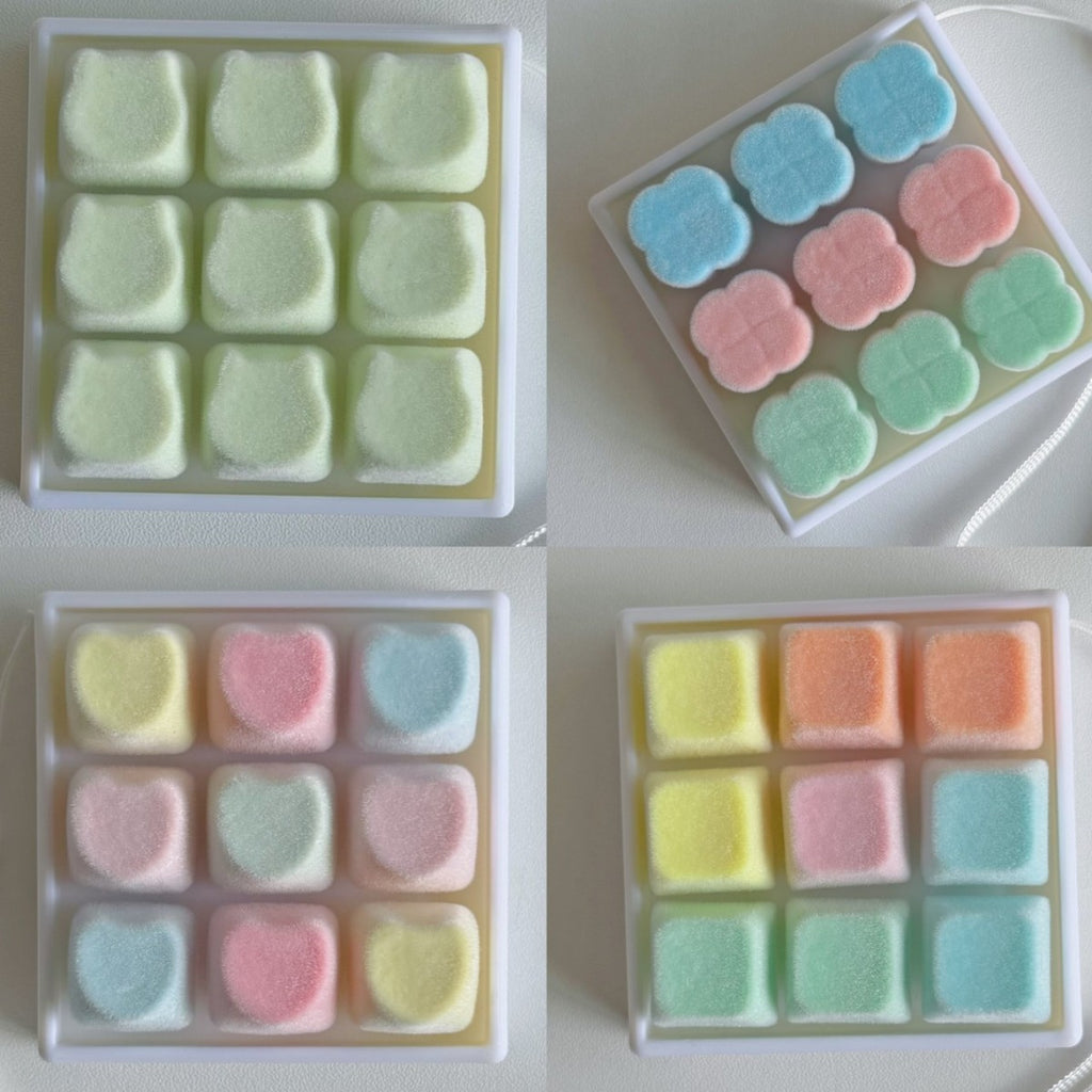 Four plush-style 9-key keycap clickers in different pastel colourways