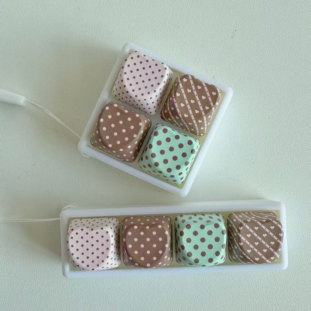 Top view of polka-dot 4-key keycap clicker keychains