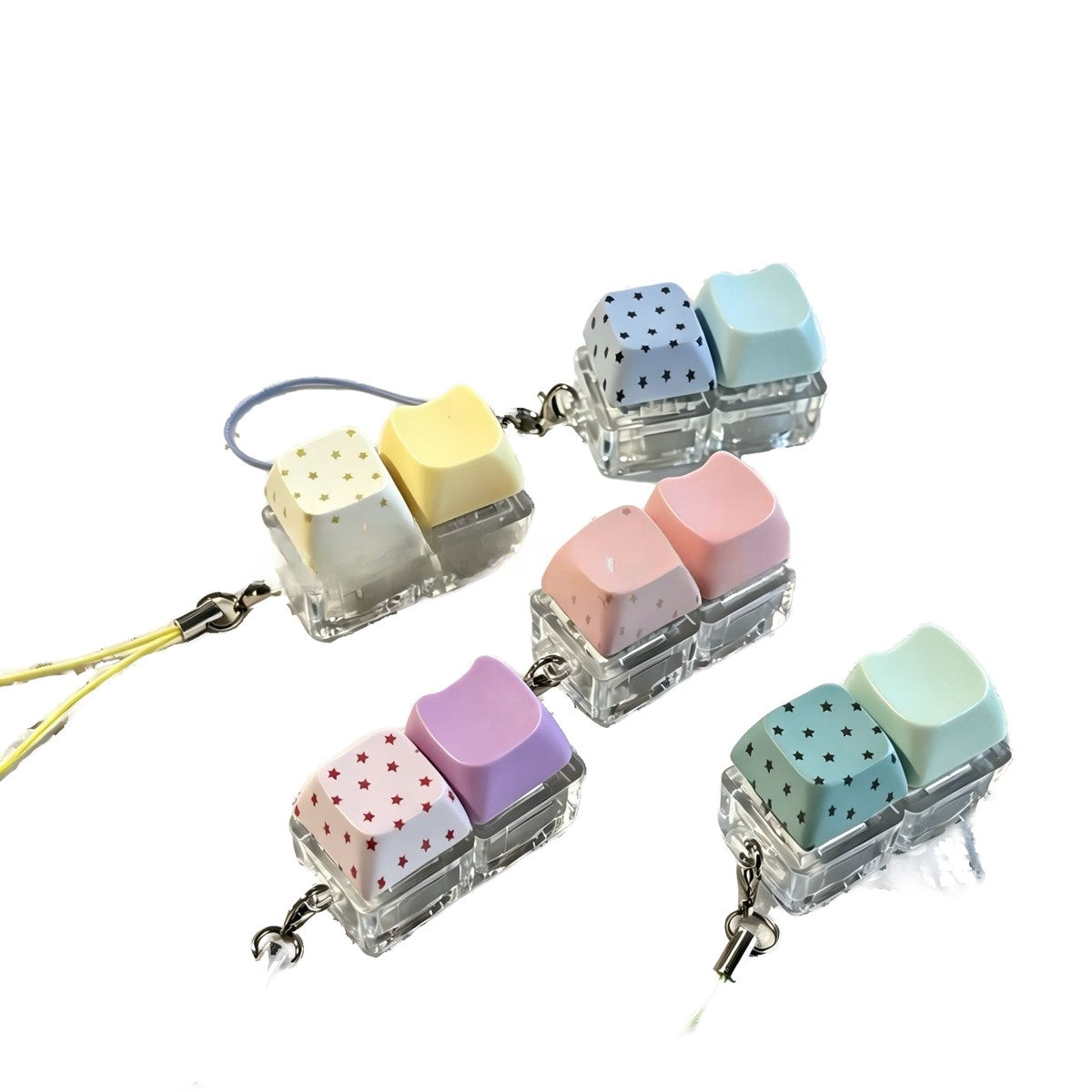 Polka-dot 2-key keycap clicker keychains in yellow, purple, pink and green with carry straps
